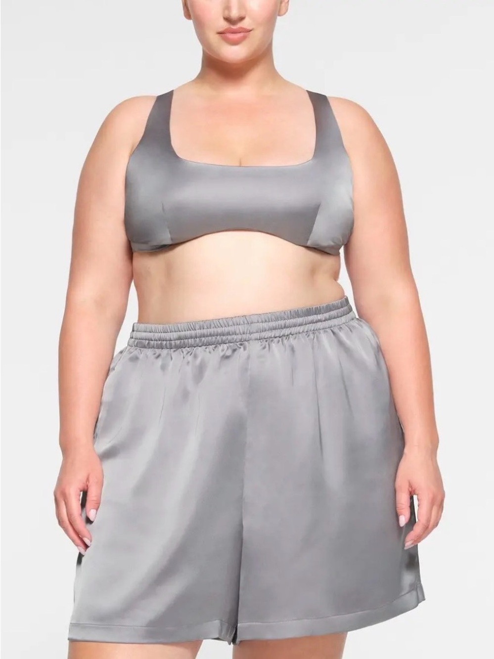 SKIMS Sporty Satin Loose Short in the metallic silver shade called Mirror